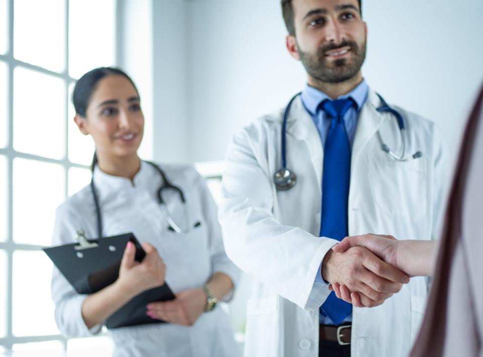 Doctor shaking hands with patient